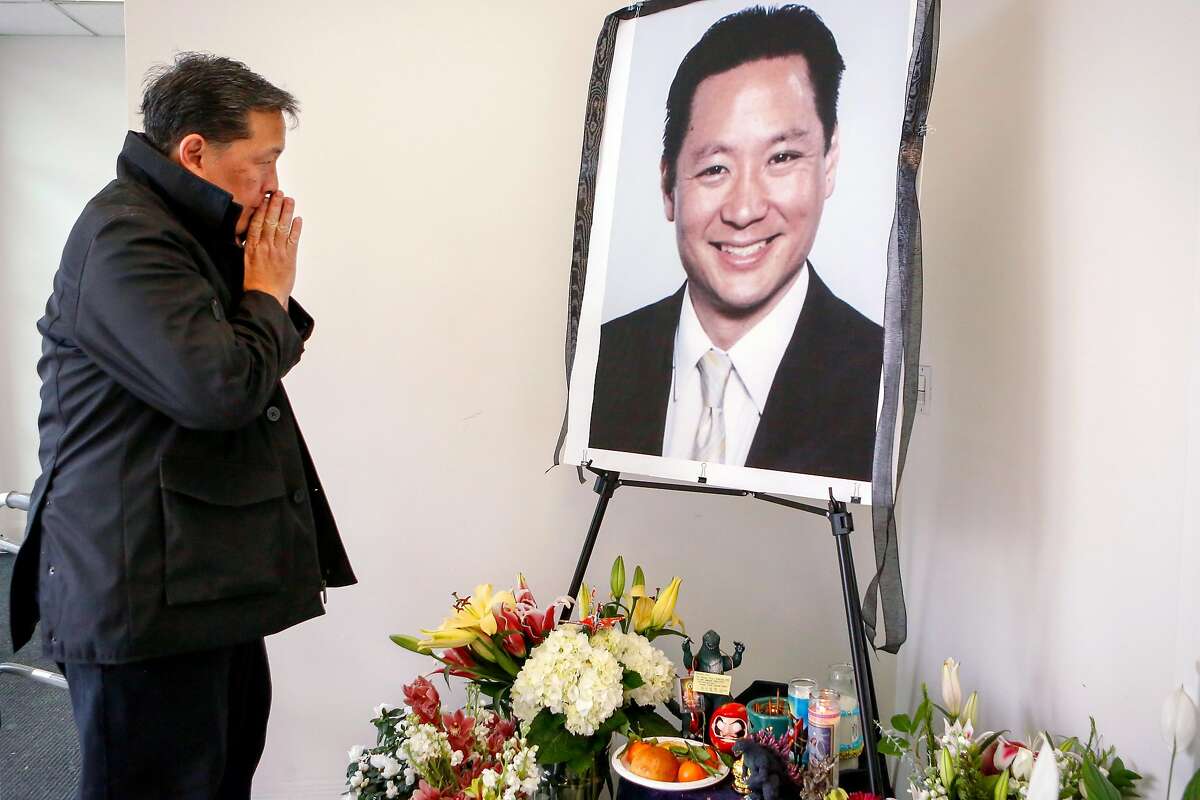 Friend Paul Osaki, director of the Japanese Cultural and Community Center, pays his respects at a memorial for Jeff Adachi at the San Francisco Public Defender's Office on Monday, February 25, 2019 in San Francisco, Calif.