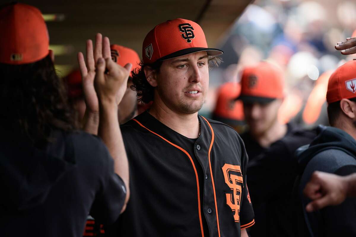 SCOTTSDALE, ARIZONA - FEBRUARY 25: Derek Holland #45 of the San Francisco Giants is congratulated in the dugout after being relieved during the second inning of the spring training game against the Chicago White Sox at Scottsdale Stadium on February 25, 2019 in Scottsdale, Arizona. (Photo by Jennifer Stewart/Getty Images)