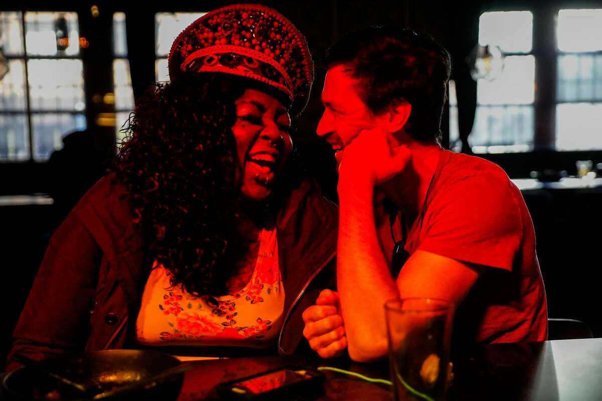 Sgt. Die Wies (left) laughs with a friend while having a drink at Jolene's bar in San Francisco, California, on Sunday, Feb. 17, 2019.