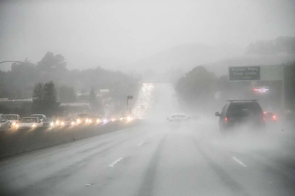 Southbound Highway 101 is heavy during the storm on Monday, Feb. 25, 2019 in Larkspur, CA.