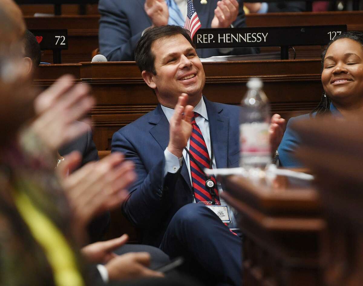 David Lehman, commissioner of the state Department of Economic Development, applauds during Gov. Ned Lamont’s budget address to the General Assembly in February.