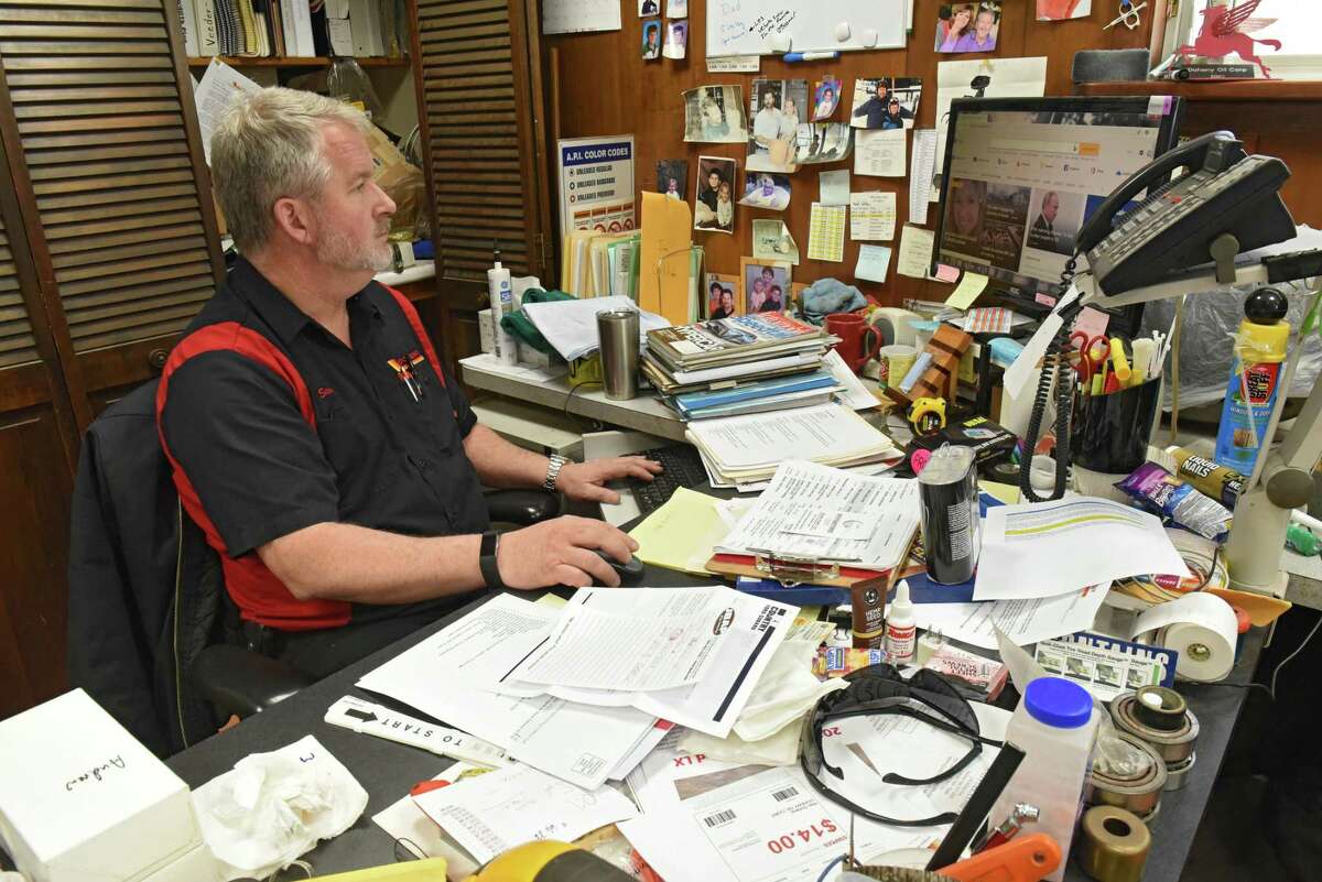 Steve Doheny works at his desk in his office at Doheny's service station on Tuesday, Feb. 26, 2019 in Ballston Spa, N.Y. After six decades, the family-owned Doheny's service and gas station is closing down. (Lori Van Buren/Times Union)