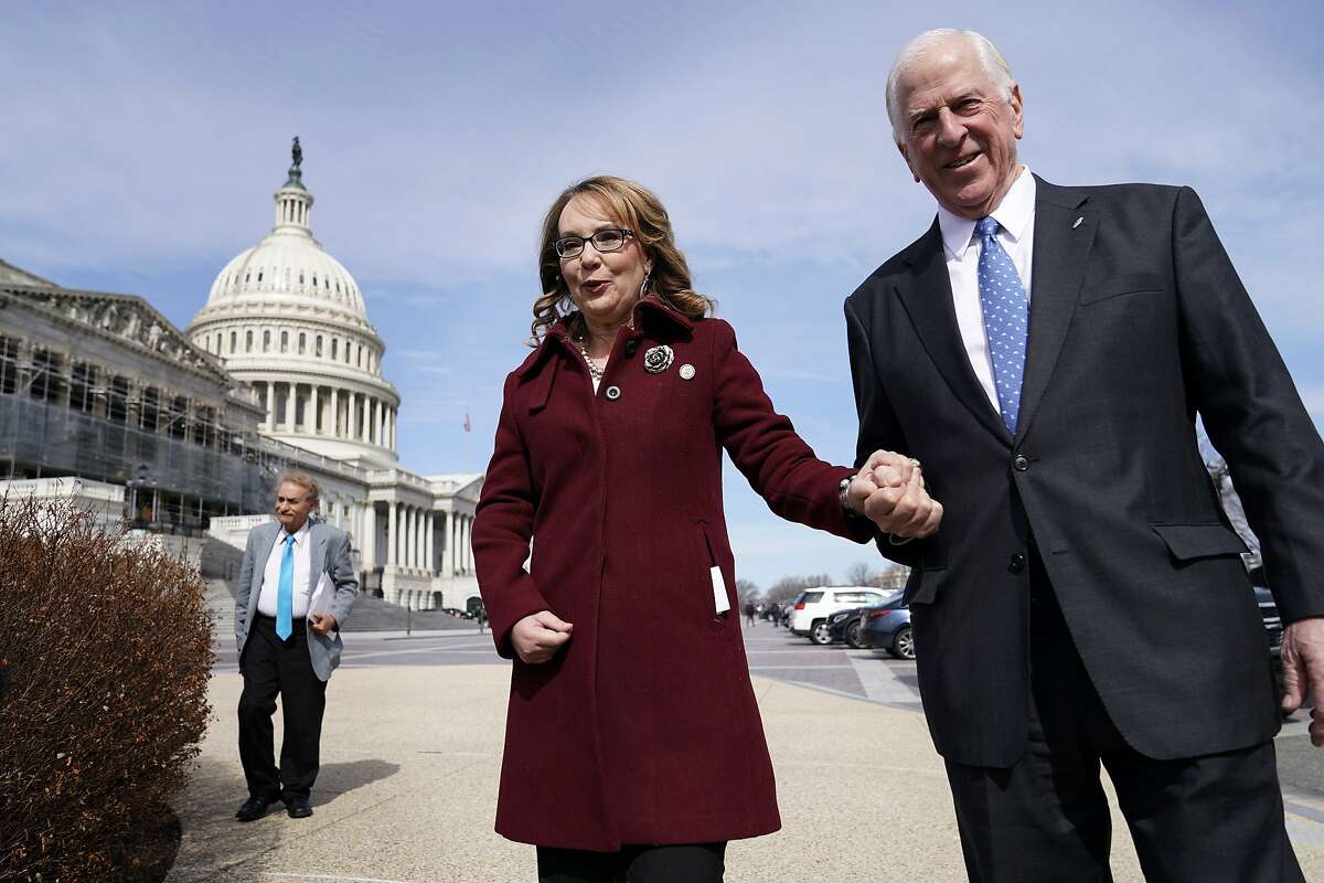 WASHINGTON, DC - FEBRUARY 26: Former Rep. Gabby Giffords (D-AZ) walks with Rep. Mike Thompson (D-CA) as she arrives to join Democratic lawmakers in support gun background checks legislation bill H.R. 8 on Capitol Hill on February 26, 2019 in Washington, D