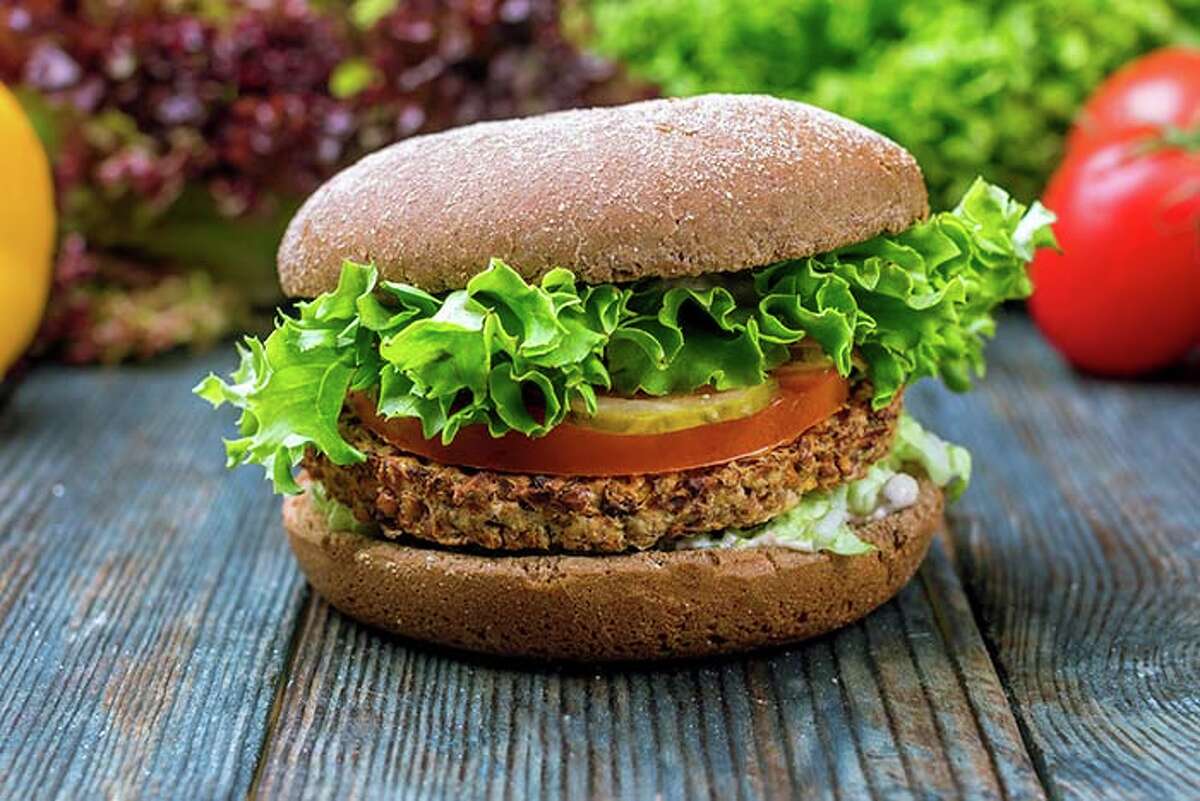 If you can find a veggie burger with a bean patty, you can easily top it with tomato, pickles, lettuce, onions, mustard, or ketchup.
