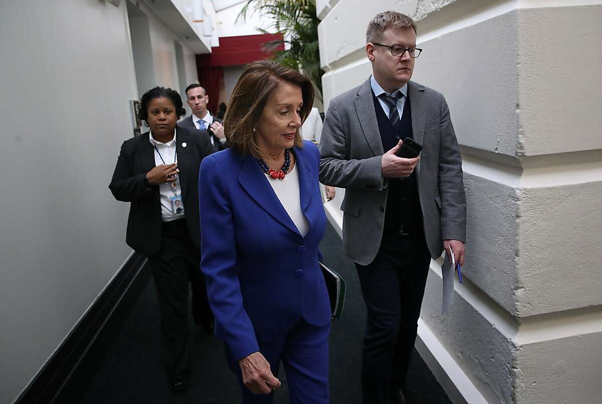 U.S. Speaker of the House Nancy Pelosi (C) walks to a weekly caucus meeting of House Democrats in the U.S. Capitol February 26, 2019 in Washington, DC. 