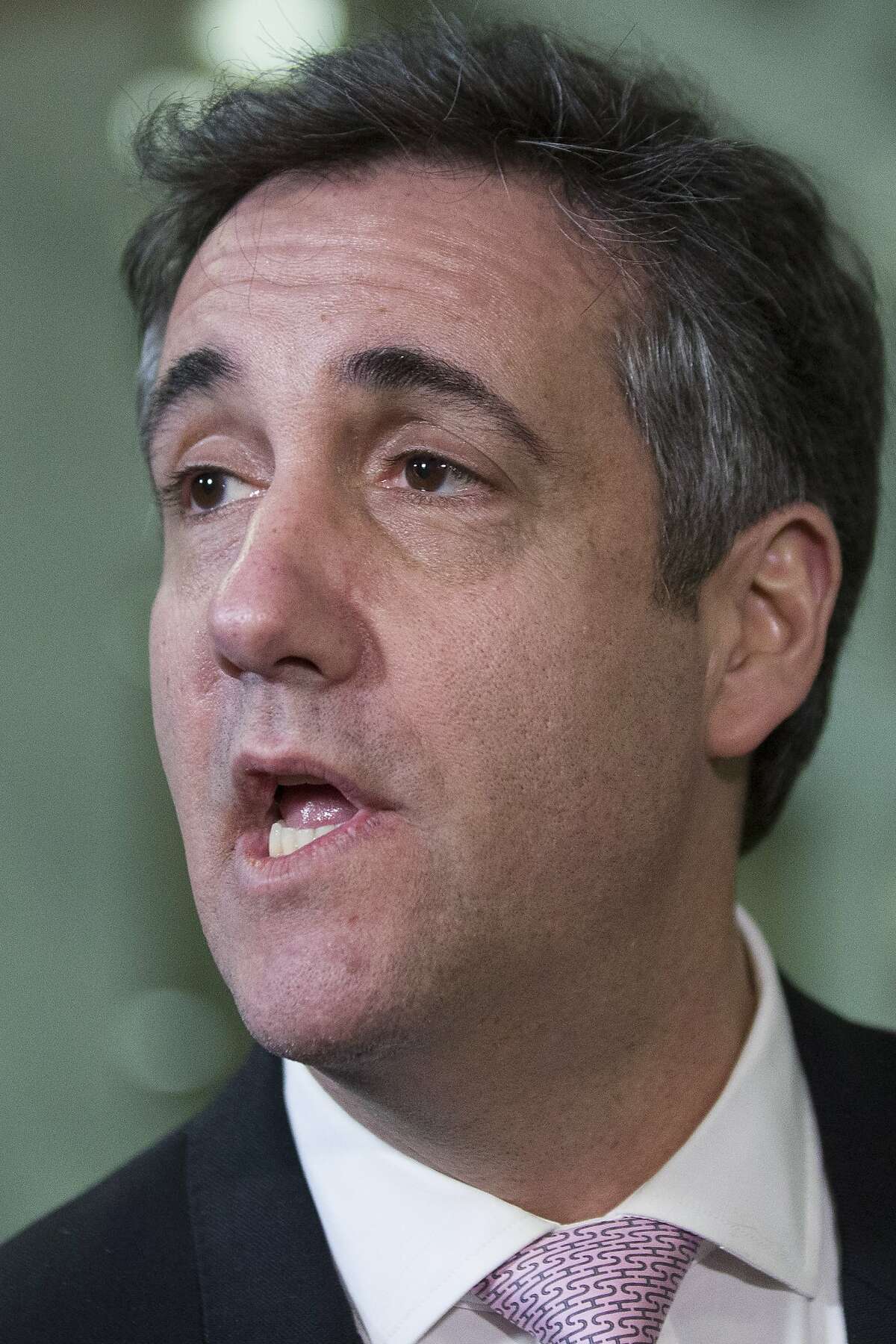 Michael Cohen, President Donald Trump's former lawyer, speaks to the media as he departs after testifying before a closed door hearing of the Senate Intelligence Committee on Capitol Hill, Tuesday, Feb. 26, 2019, in Washington. Click through the gallery for reactions to his comments on Thursday.