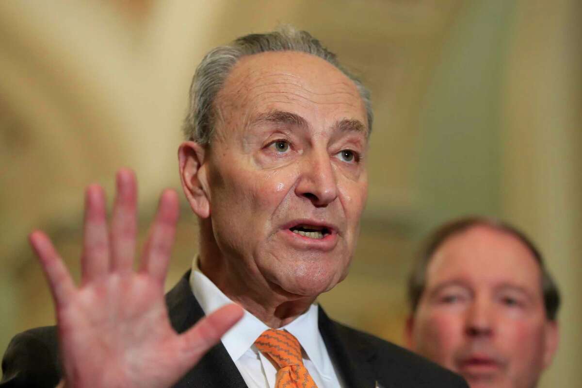 Senate Minority Leader Chuck Schumer of N.Y. with Sen. Tom Udall, D-N.M., speaks to reporters on Capitol Hill in Washington, Tuesday, Feb. 26, 2019. (AP Photo/Manuel Balce Ceneta)