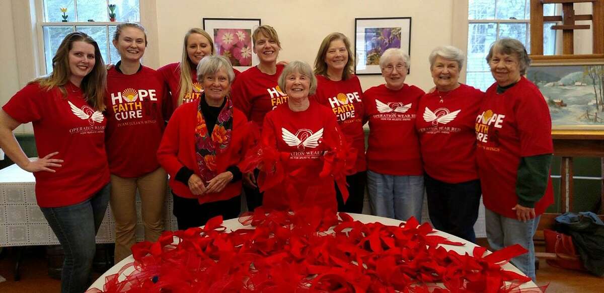 Julia's Wings Foundation in Sherman is gearing up for its March 3-10 Operation Wear Red Campaign, held in conjunction with the National Organization for Rare Diseases' Rare Disease Day. Above, volunteers gather at Sherman Senior Center to make red bows to distribute in the coming days.