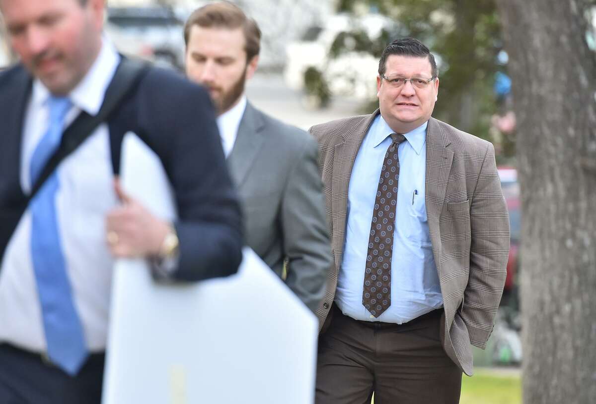 Texas Director of Elections Keith Ingram walks into the John Wood Federal Courthouse for a hearing last week about the state's effort’s to purge names from voter rolls.