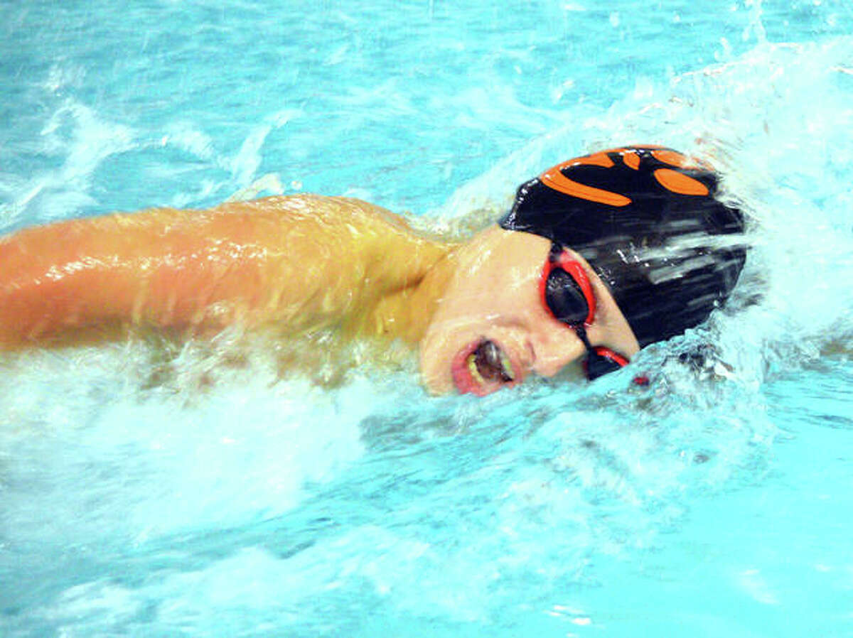Edwardsville freshman Evan Grinter competes in the 200-yard freestyle during the Edwardsville Sectional on Feb. 16 at Chuck Fruit Aquatic Center.