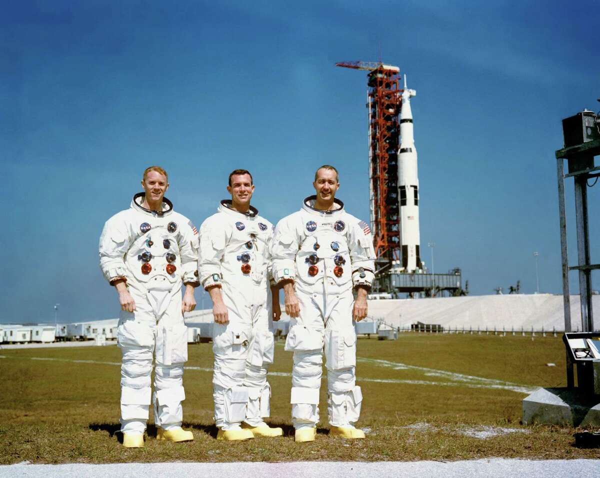 (23 Feb. 1969) --- These three astronauts are the prime crew of the Apollo 9 Earth-orbital space mission. From left are are Russell L. Schweickart, lunar module pilot; David R. Scott, command module pilot; and James A. McDivitt, commander. In the background is the Apollo 9 space vehicle on Pad A, Launch Complex 39, Kennedy Space Center. 