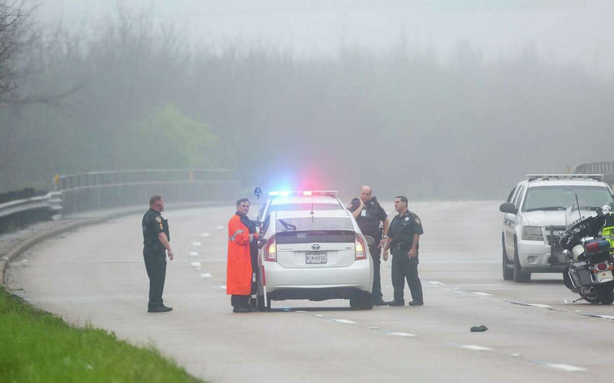 Harris County Sheriff's Office deputies investigate where a driver fatally struck a pedestrian on Beltway 8, just south of Philippine Street on Wednesday.