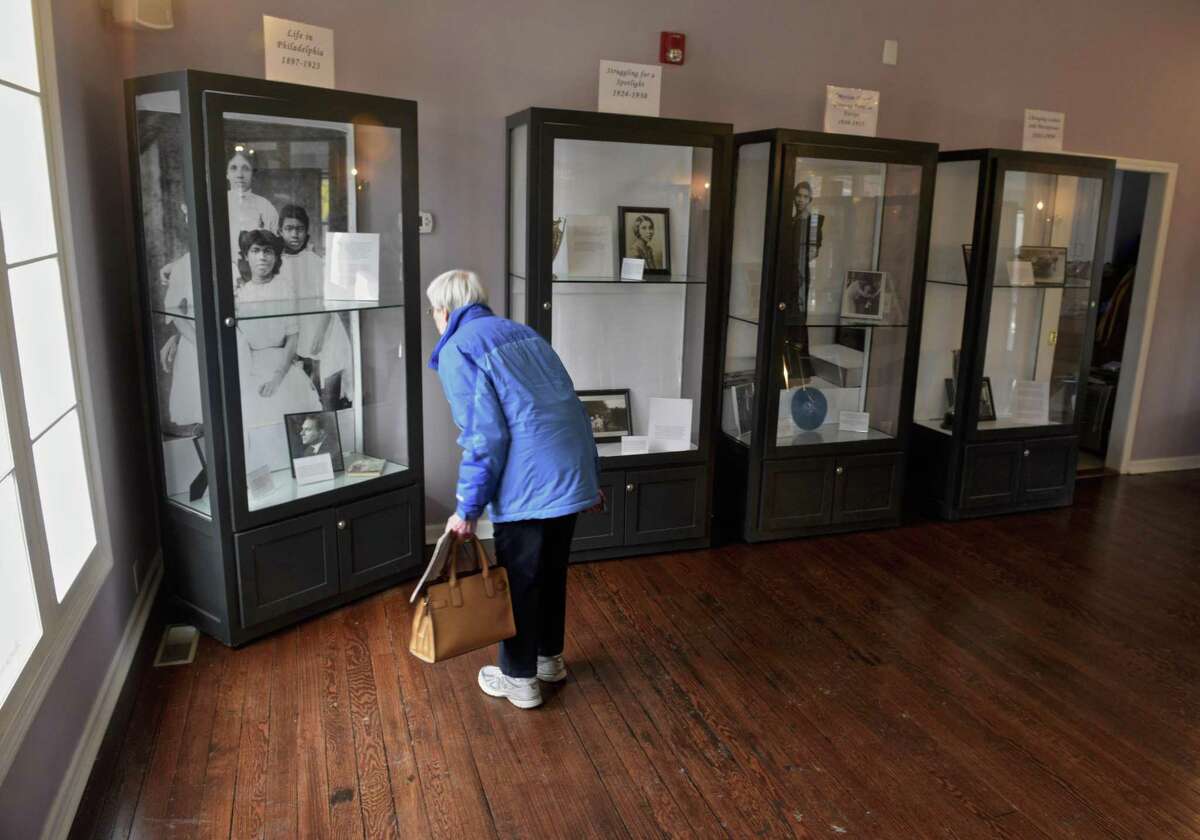 Barbara Susnitzky, of Danbury, looks at an exhibit in the Marian Anderson Studio at the Danbury Museum & Historical Society which celebrated the birthday of singer Marian Anderson on Wednesday. Anderson was one of the most celebrated singers of the 20th century. She and her husband, architect Orpheas Fisher, lived in Danbury for 50 years. Wednesday, February 27, 2019, Danbury, Conn.