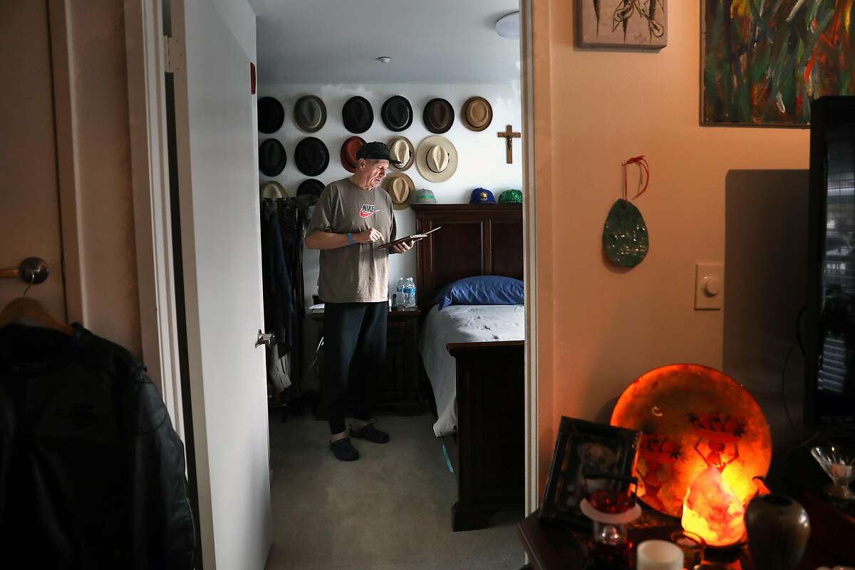 Kenny Black surfs the internet in his apartment on Wednesday, Feb. 27, 2019, in Calistoga, Calif. In a new report rating cities based on meeting government mandated housing creation goals, Calistoga is the highest-rated city in the Bay Area. Although its goal was only 27 new senior housing units, there are 30 units.