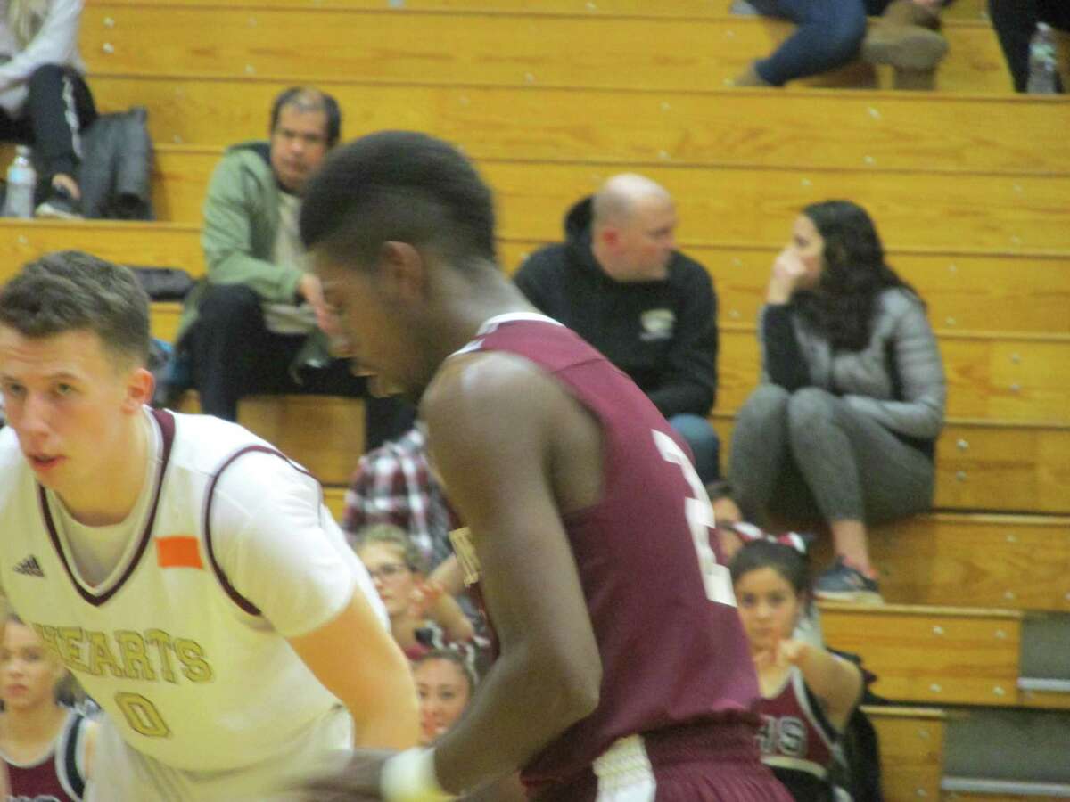 Torrington's Tyreek Davis had 19 of his 23 points in the first half of the Red Raiders' loss to four-time defending NVL Tournament champion Sacred Heart.