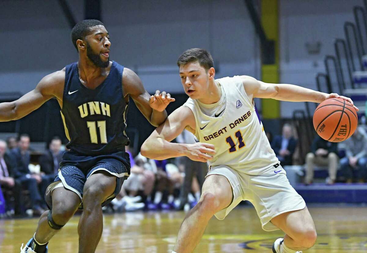 University at Albany's Cameron Healy drives to the net against New Hampshire's Jordan Reed during a basketball game at SEFCU Arena on Wednesday, Feb. 27, 2019 in Albany, N.Y. (Lori Van Buren/Times Union)