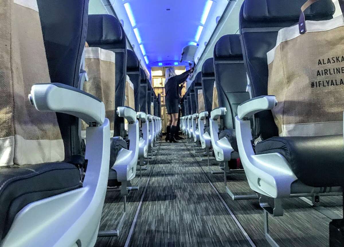 New carpeting, seats and blue mood lighting and more on Alaska Airlines Airbus A321- a big change from the Virgin America configuration