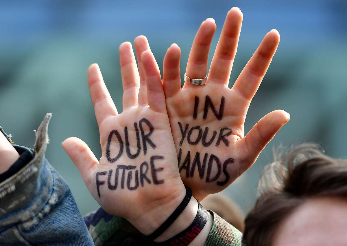 Students take part in a march for the environment and the climate o, in Brussels, on February 21, 2019. - Greta Thunberg, the 16-year-old Swedish climate activist who has inspired pupils worldwide to boycott classes, urged the European Union on February 21, 2019 to double its ambition for greenhouse gas cuts. (Photo by EMMANUEL DUNAND / AFP) (Photo credit should read EMMANUEL DUNAND/AFP/Getty Images)