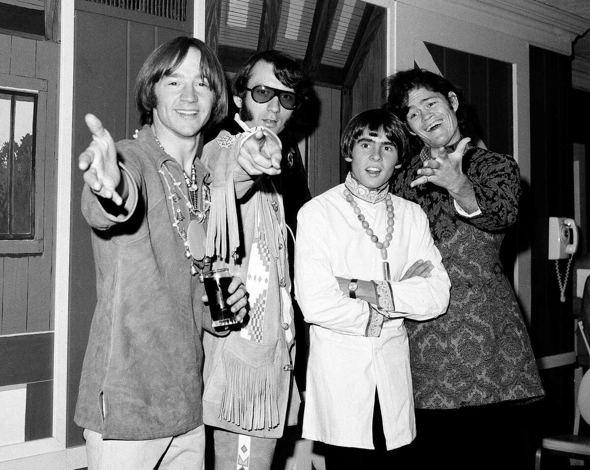 This July 6, 1967, photo shows, from left, Peter Tork, Mike Nesmith, David Jones and Micky Dolenz of the musical group The Monkees at a news conference at the Warwick Hotel in New York.