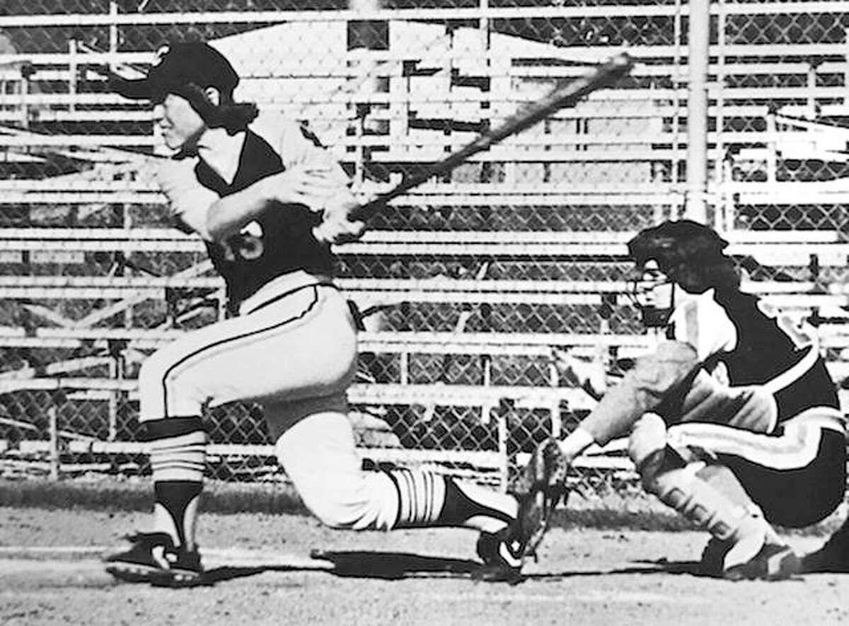 Terri Allen Taake takes a swing during her softball playing days at Quincy College. A 1974 Jersey High graduate, she also played basketball, field hockey and volley at Quincy and will be inducted Saturday into the Quincy University Athletic Hall of Fame.