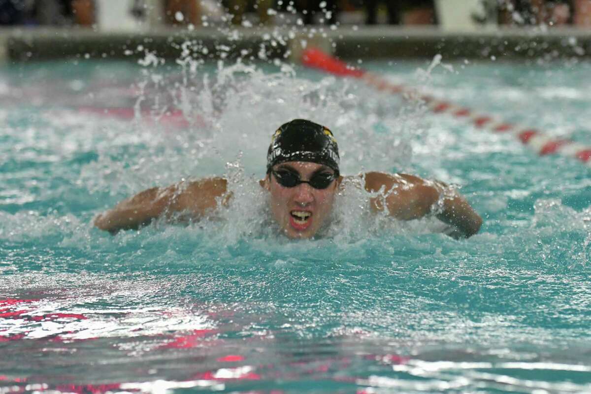 Greenwich’s Stephan Todorovic swims the butterfly leg of the 200-yard medley relay during the FCIAC Swimming Championships on Feb. 28 at Greenwich High School.