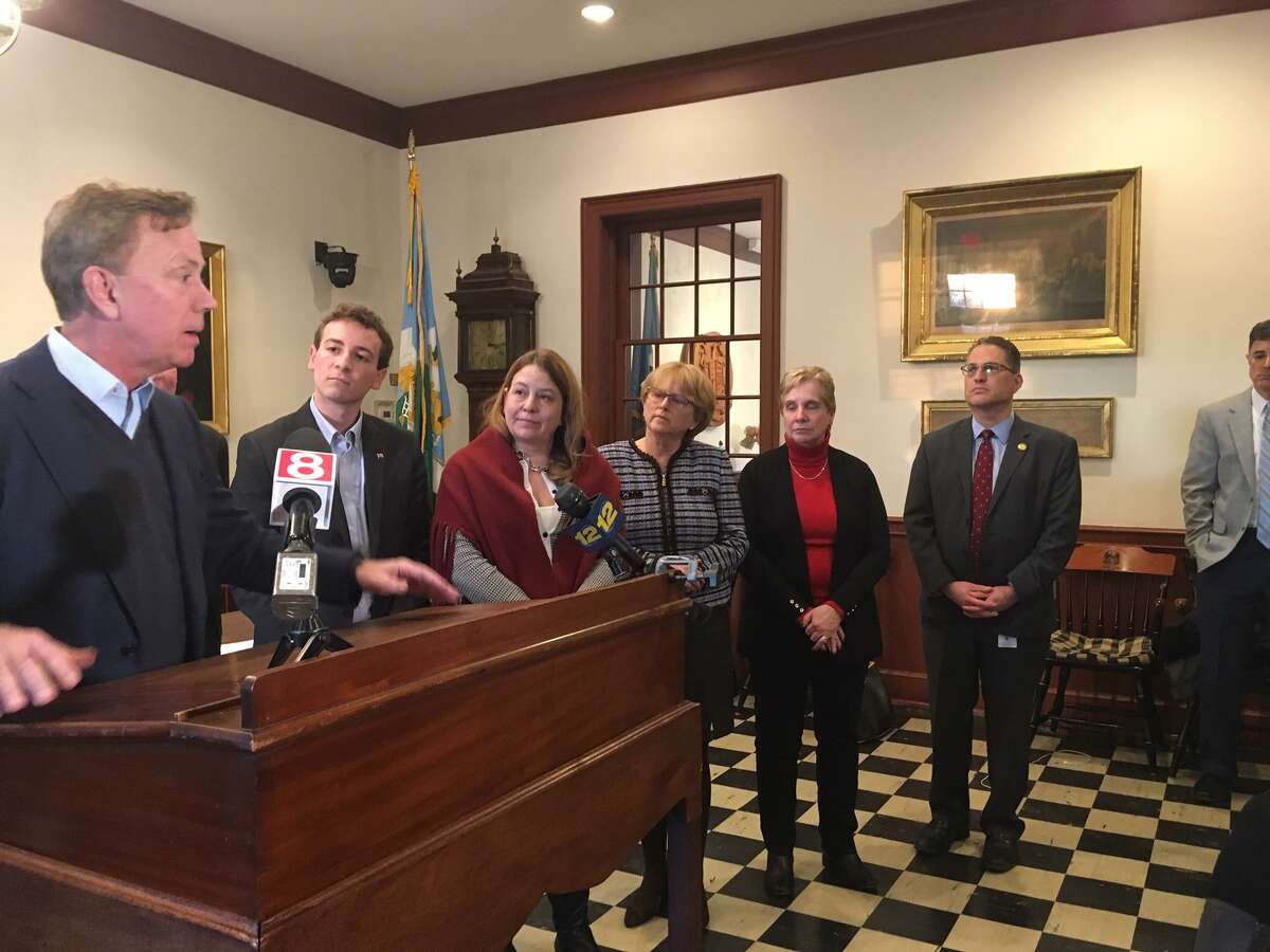 Gov. Ned Lamont meets with a bipartisan group of municipal leaders in Weston on Feb. 26.