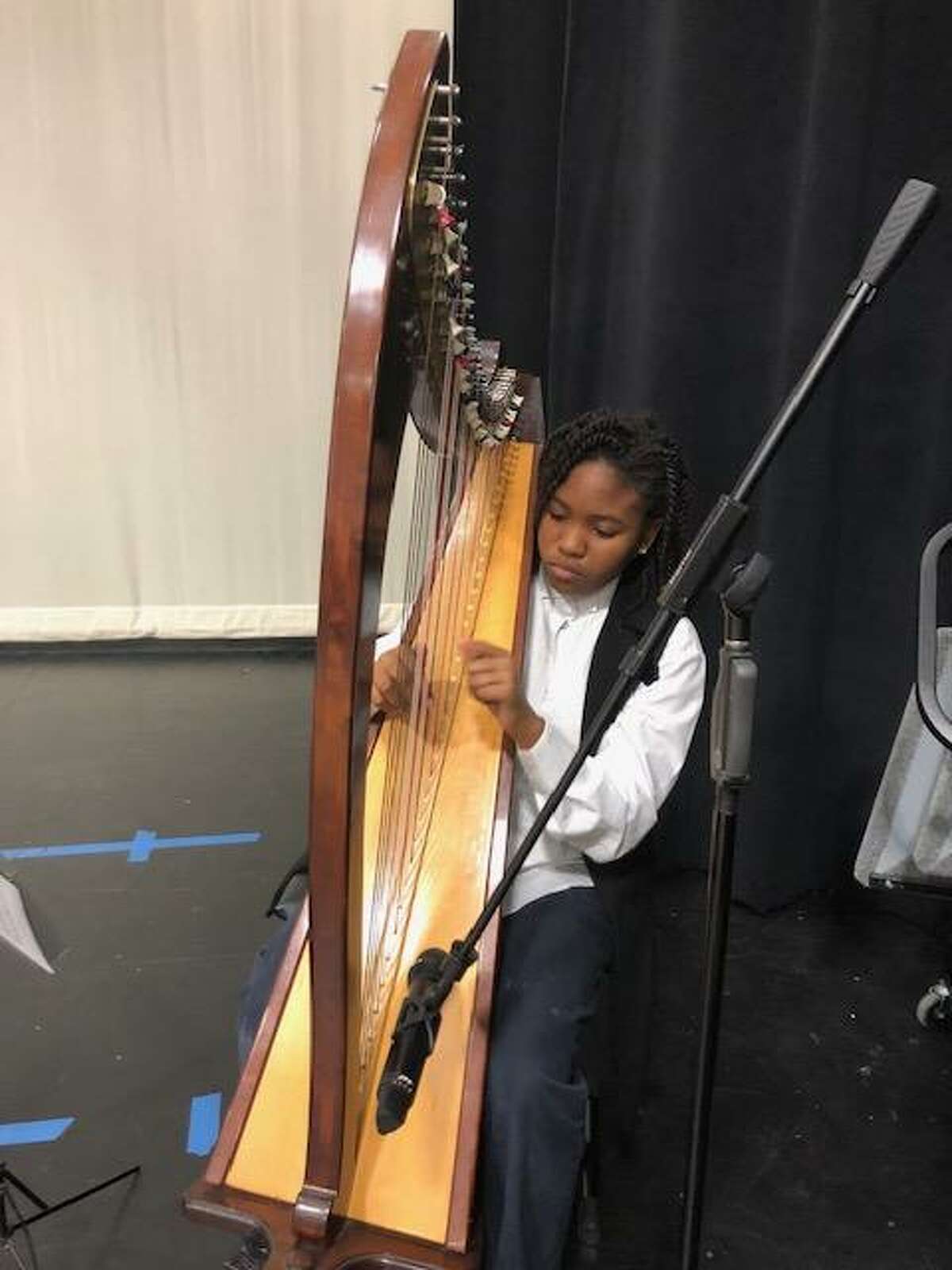 Sixth-grader Hannah Blackmon was the Goblet harpist at Aristoi Classical Academy's Tea & Poetry Competition, the Goblet of Apollo.