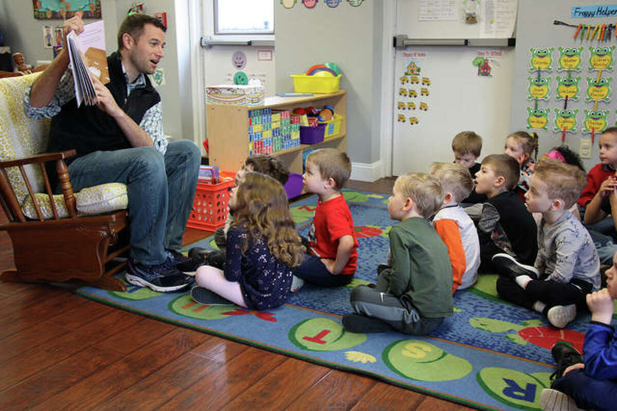 Preschoolers at Together We Learn watch intently and listen raptly as local author Doug Shapiro reads his children’s book, “The Frox,” Friday in celebration of Read Across America.