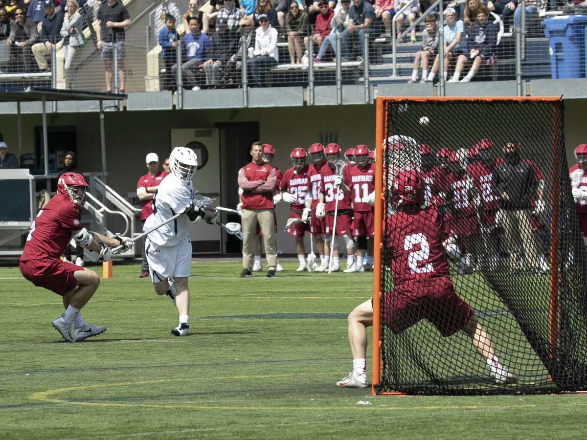 Yale’s Jack Tigh winds up for a shot against Harvard earlier this season.