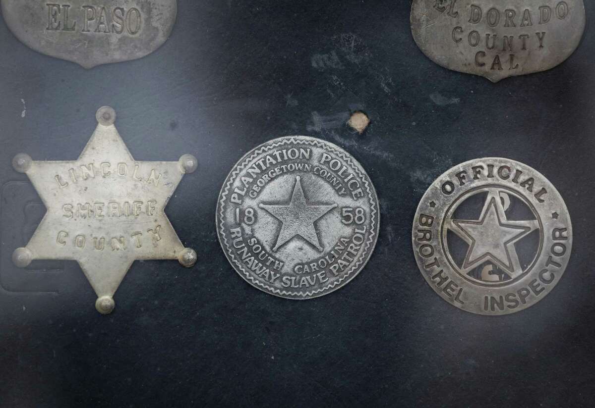 A collection of badges belonging to Larry Callies, co-founder of the Black Cowboy Museum in Rosenberg, Texas, are displayed on Black Heritage Day at the Houston Livestock Show and Rodeo Friday, March 1, 2019, in Houston.