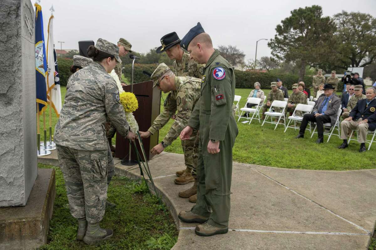 The 502d Air Base Wing and the Stinson Flight No. 2 Order of Daedalians held a wreath-laying ceremony Friday, March 1, 2019 commemorating the first military flight, which took place on Fort Sam Houston's MacArthur Parade Field. The March 2, 1910 flight was piloted by Lt. Benjamin Foulois, who flew four times that day, making the first solo takeoff, first solo landing and first crash. Army Col. Peter Velesky, deputy commander of the 502nd Air Base Wing (left), is flanked by Col. Samuel E. Fiol, (center) and Lt. Col. Emil Bliss, director of community initiatives with the 12th Flying Training Wing, at the wreath-laying ceremony.