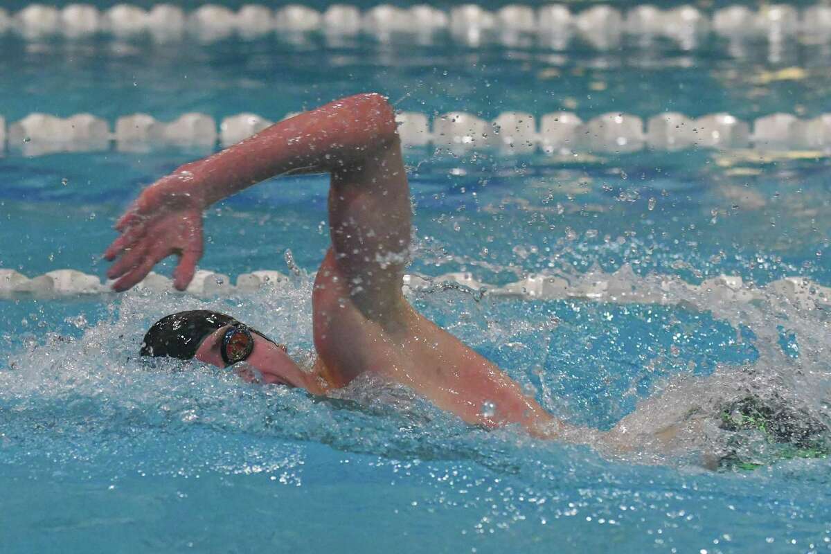 Pomperaug’s William Regan of Pomperaug swims to victory in the 200-yard freestyle Friday.