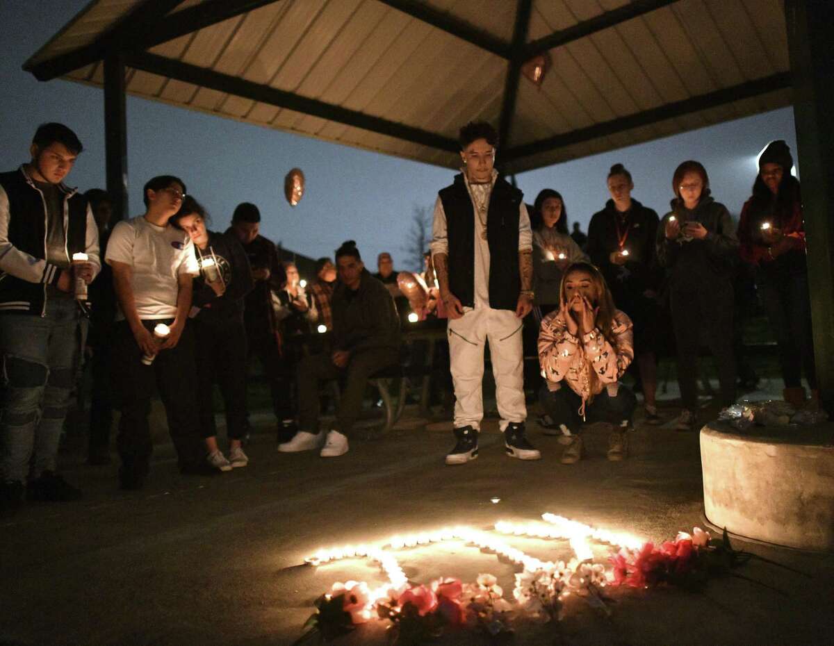 People attend a vigil for Kaitlin Leonor Castilleja, 18, whose killing was rumored to have occured in the wake of a social media feud, on Friday, March 1, 2019. A 16-year-old girl, a student at Madison High School, is accused in the fatal stabbing.