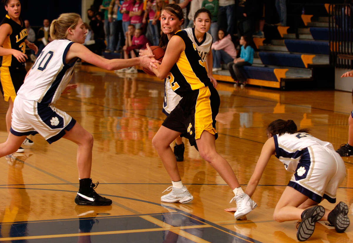 Bullock Creek's Renae Lange tries to wrest the ball away from a Lakeview defender during a Feb. 18, 2008 district game.