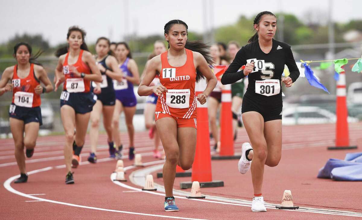 Runners from area high schools participate in the 3200-meter race Friday.