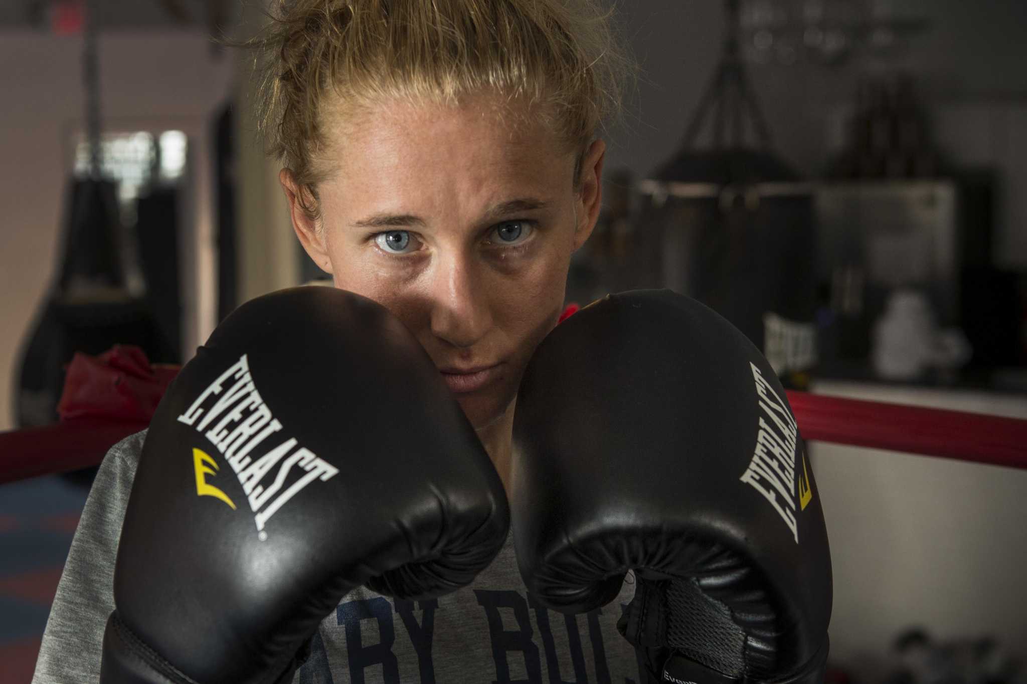 Houston boxer Ginny Fuchs and the opponent outside the ring