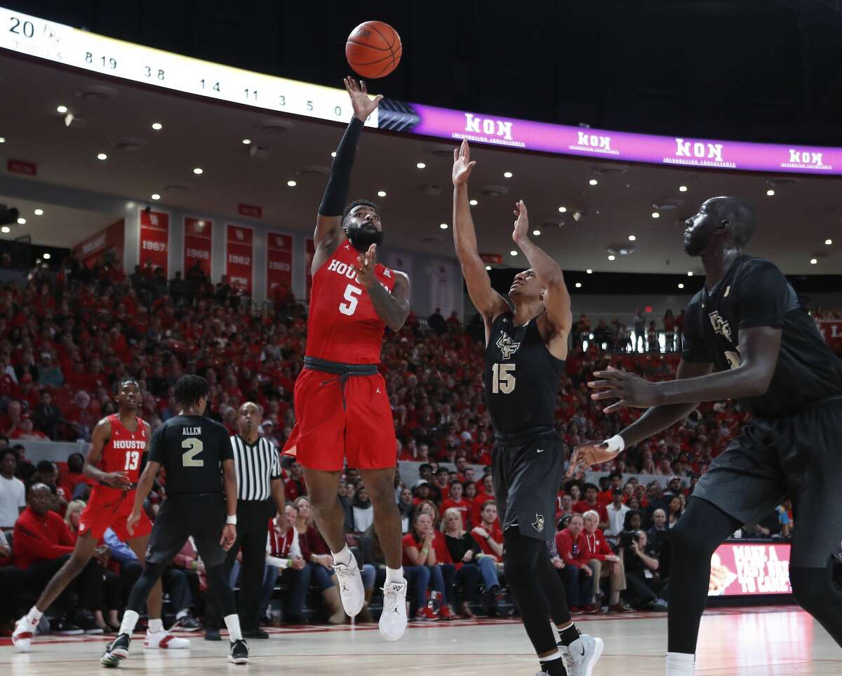 Houston guard Corey Davis Jr. (5) goes up for a shot against Central Florida guard Aubrey Dawkins (15) during the first half on a NCAA basketball game at Fertitta Center on Saturday, March 2, 2019, in Houston.