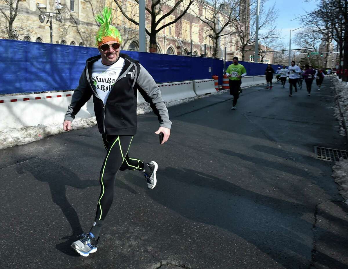 New Haven, Connecticut - Sunday, March 3, 2019: The 22nd annual 99.1 PLR Connex Credit Union Shamrock & Roll 5K road race starting on Tower Parkway and finishing at Toad Place in New Haven Sunday to benefit The Diaper Bank. The race is recognized as the USATF-CT 5K State Championship and is one of the largest winter road races held in Connecticut. Toad's Place hosted the annual events after-race party. 