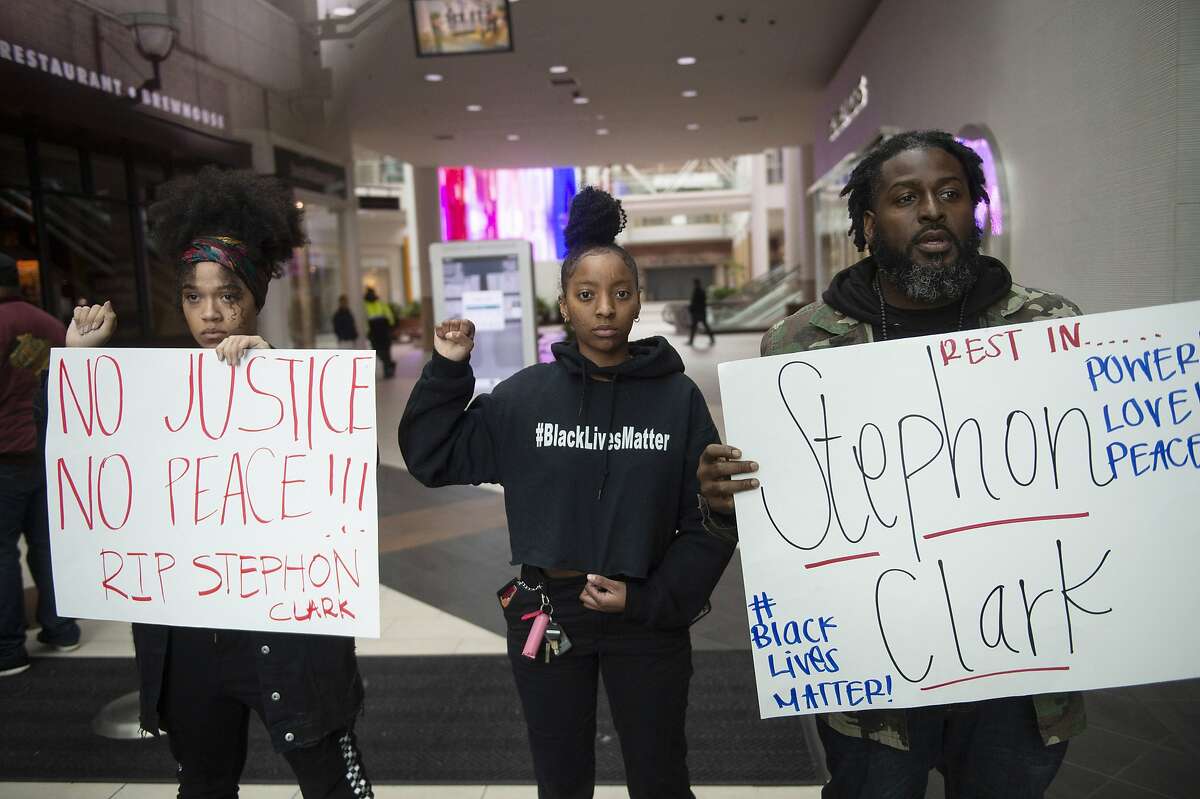 Protesters stage a sit-in for Stephon Clark, who was killed by police, at Arden Fair Mall in Sacramento, Calif., Sunday, March 3, 2019, following the Sacramento District Attorney's decision not to charge officers involved in last year's shooting of Clark. (Lezlie Sterling/The Sacramento Bee via AP)