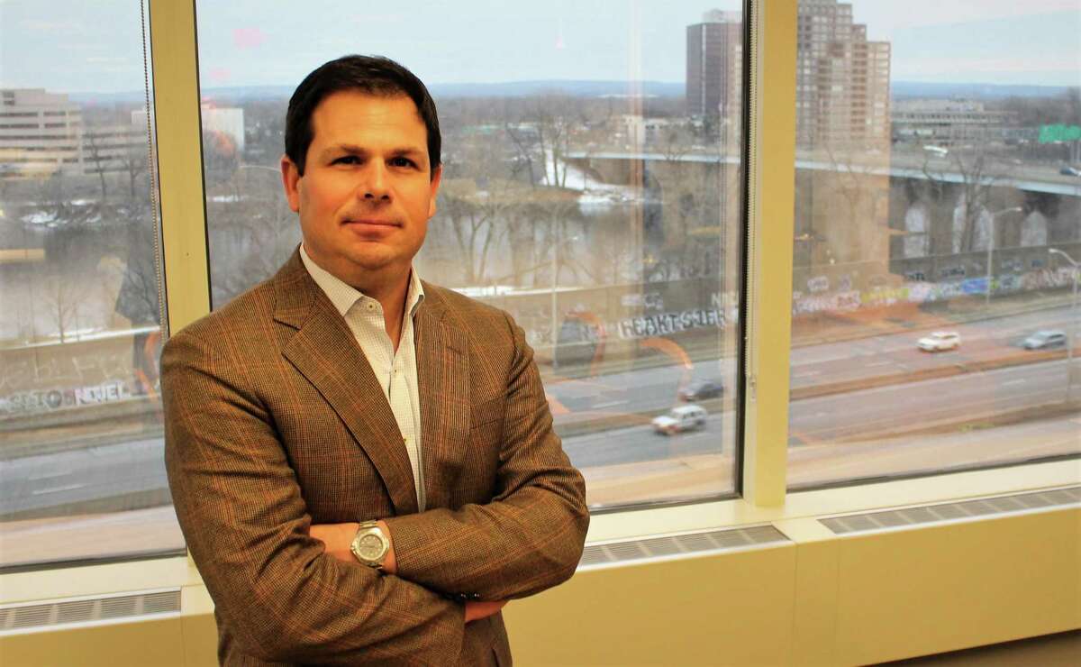 David Lehman, Gov. Ned Lamont's appointee as commissioner of the state Department of Economic and Community Development, in his new office overlooking the Connecticut River in Hartford