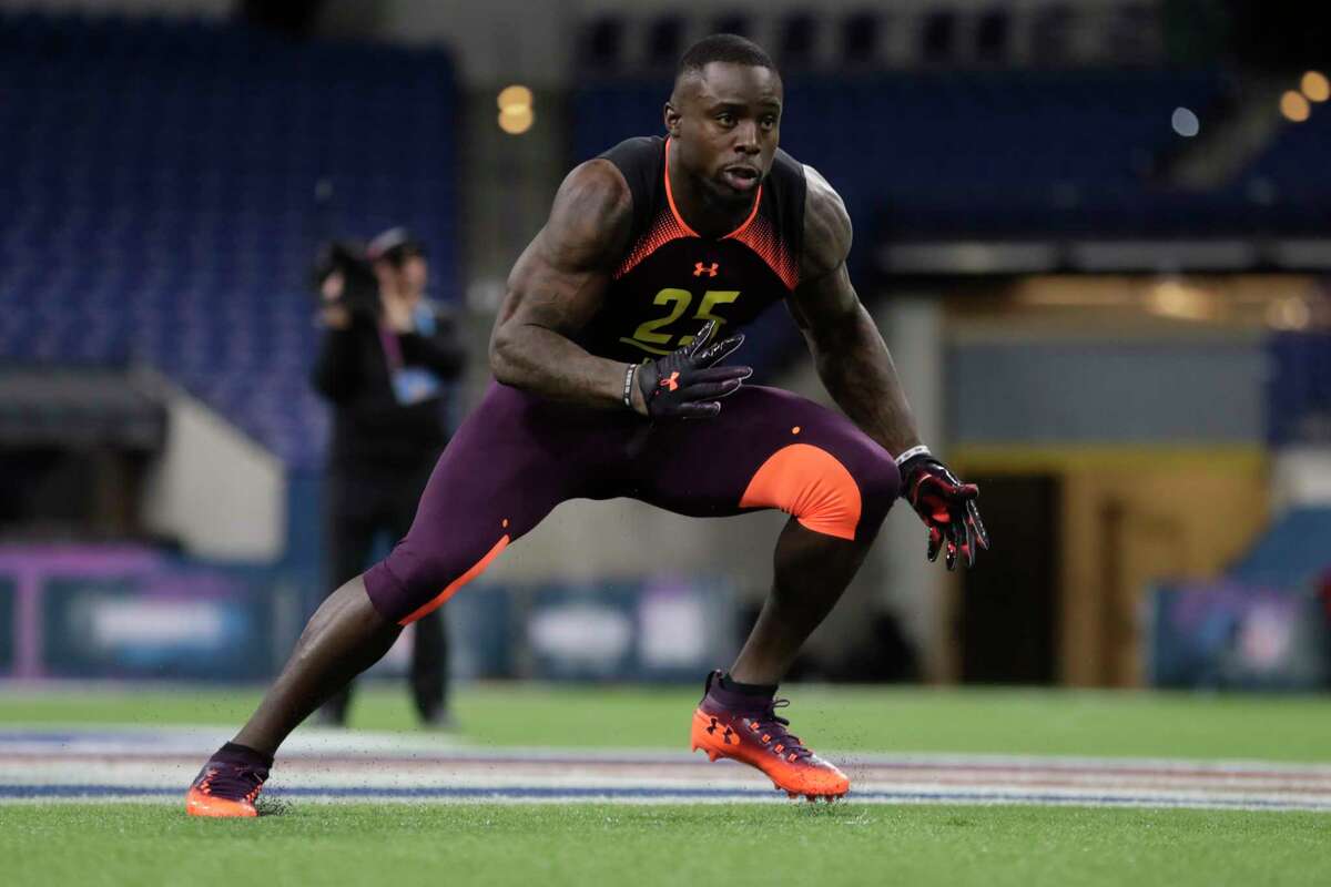 Texas linebacker Gary Johnson runs a drill at the NFL football scouting combine in Indianapolis, Sunday, March 3, 2019. (AP Photo/Michael Conroy)
