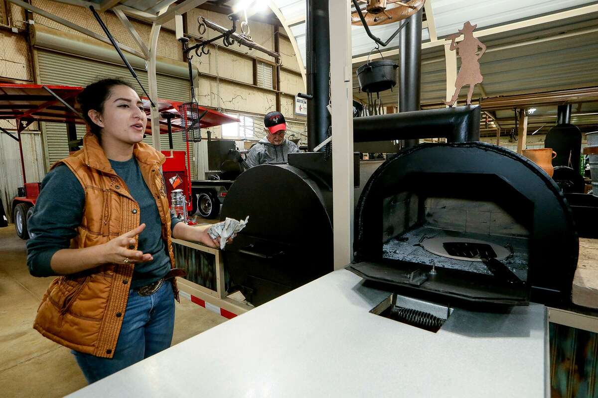 Taiz Ochoa, 17, talks about the pizza oven she included in the trailer barbecue pit she named “Living & Grilling” she built for the Junior Agricultural Mechanics Show at the San Antonio Stock Show and Rodeo. The trailer is the fourth one Ochoa, a senior at Roma High School, has built.