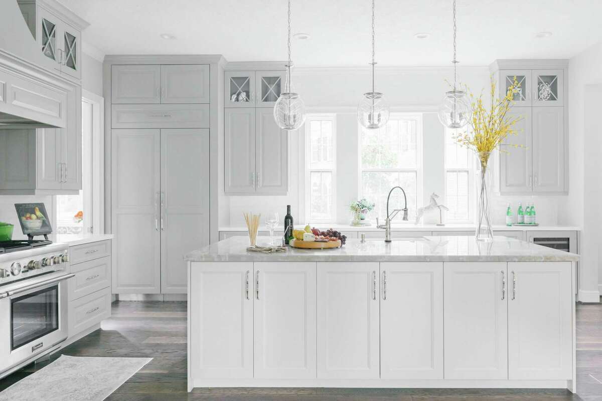 This bright, transitional style kitchen was designed by Chairma Design Group.