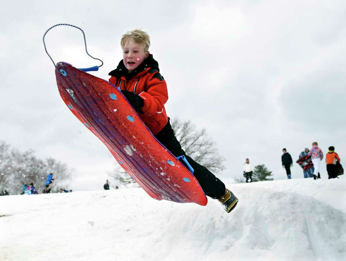 Greenwich's Harry Raabe, 9, catches air on a sled jump at Innis Arden Golf Club in Old Greenwich, Conn. Monday, March 4, 2019. Greenwich received eight inches of snow that caused school to be cancelled for the first time in the 2018-2019 year.