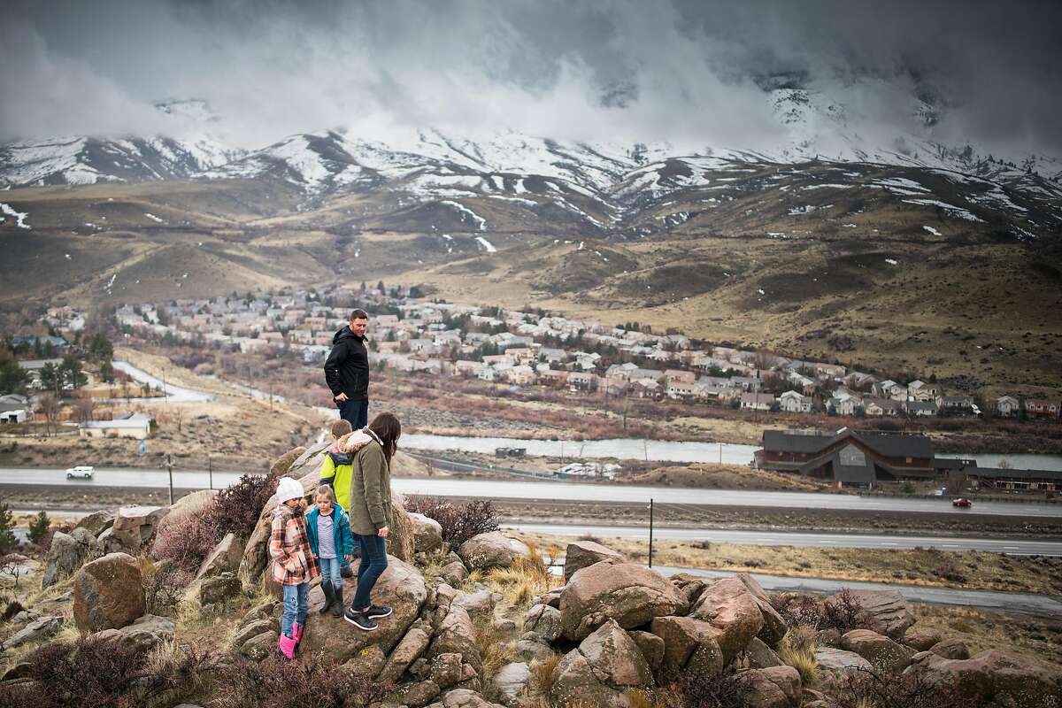 Bryan Allegretto walks with his family to the top of a hill that he owns in Reno, Nevada on Sunday March 3rd, 2019