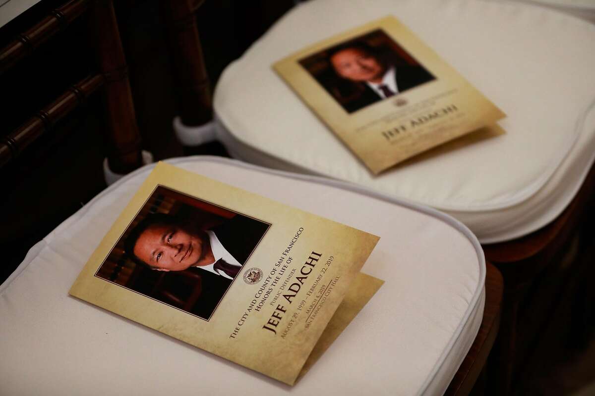 Programs sit on seats ahead of Public Defender Jeff Adachi's memorial service at City Hall in San Francisco, California, on Monday, March 4, 2019.