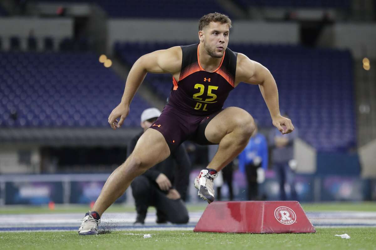 Ohio State defensive lineman Nick Bosa runs a drill at the NFL football scouting combine in Indianapolis, Sunday, March 3, 2019. (AP Photo/Michael Conroy)