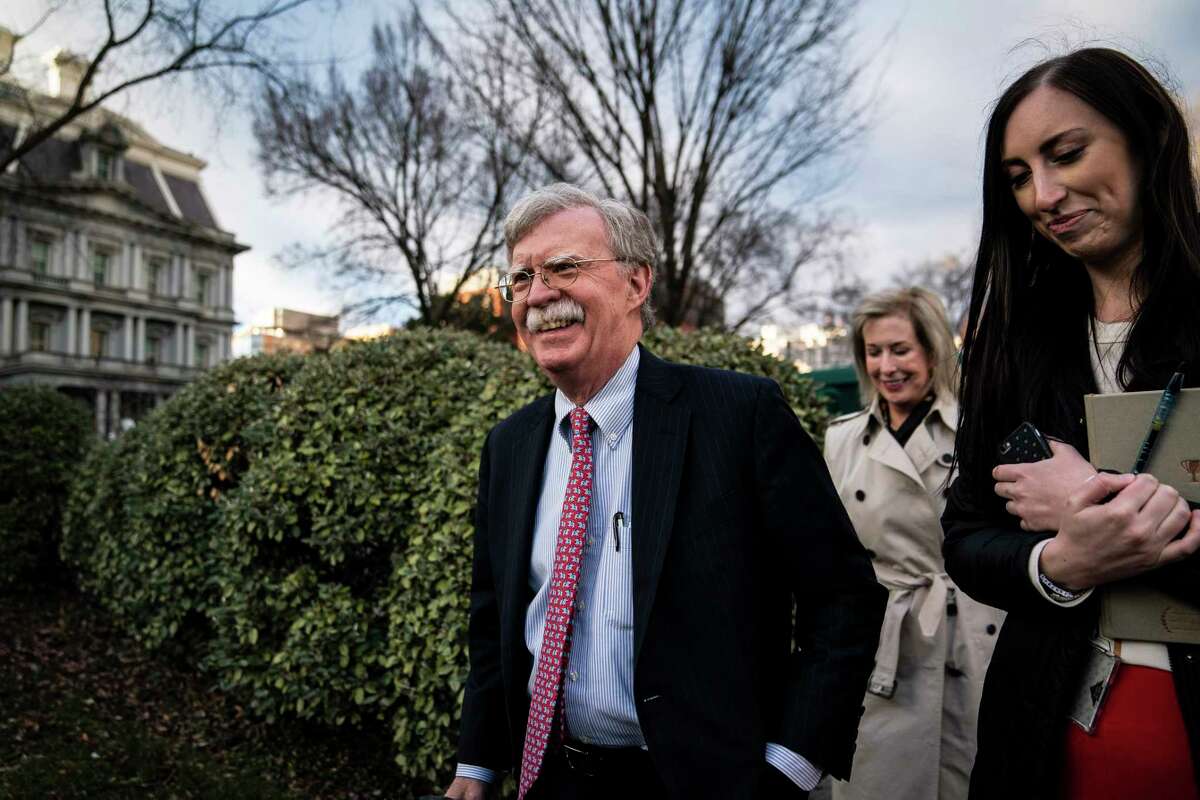National security adviser John Bolton walks back to the West Wing in January.