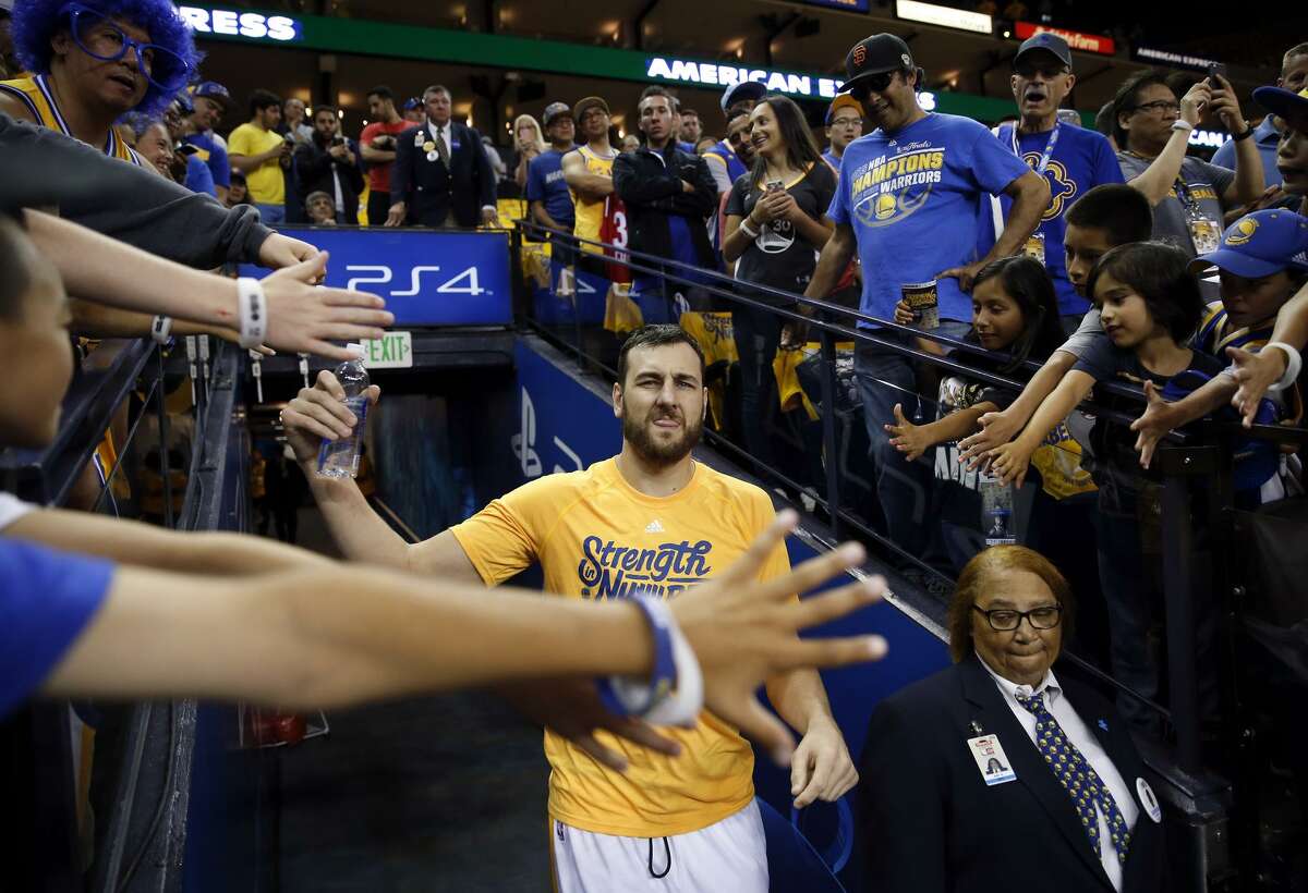 Golden State Warriors' Andrew Bogut heads to the court to warm up before playing Oklahoma City Thunder in Game 1 of NBA Playoffs' Western Conference Finals at Oracle Arena in Oakland, Calif., on Monday, May 16, 2016.