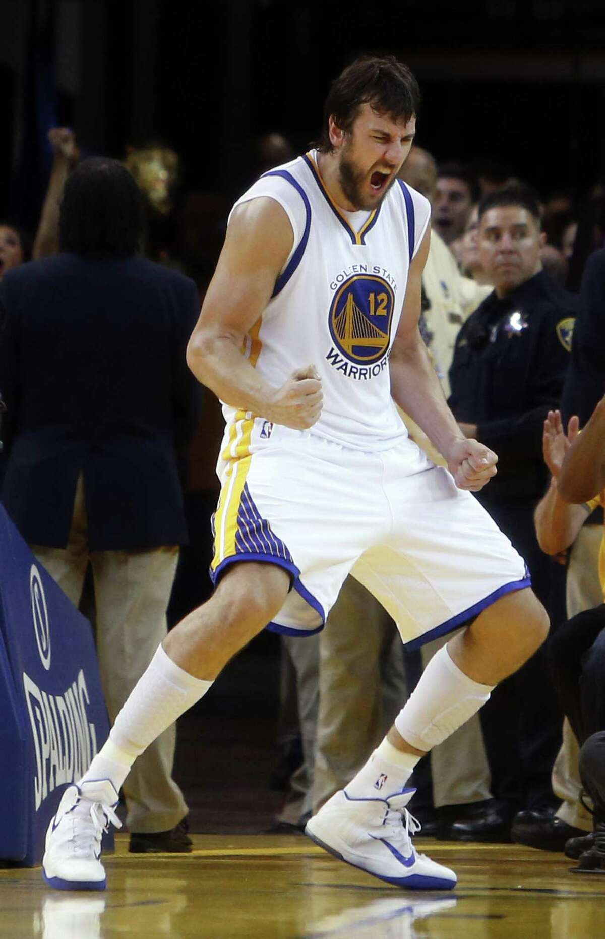 Golden State Warriors' Andrew Bogut celebrates his 4th quarter basket during 99-98 win over Houston Rockets in Game 2 of NBA Playoffs' Western Conference Finals at Oracle Arena in Oakland, Calif., on Thursday, May 21, 2015.